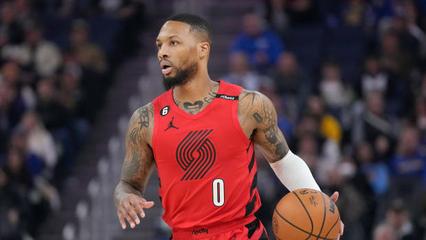 Portland Trail Blazers guard Damian Lillard brings the ball up the court against the Golden State Warriors.